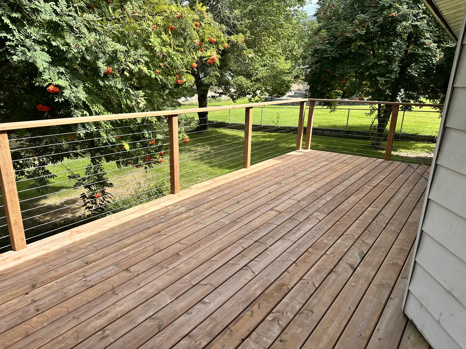 Pressure-treated deck with stainless steel railing